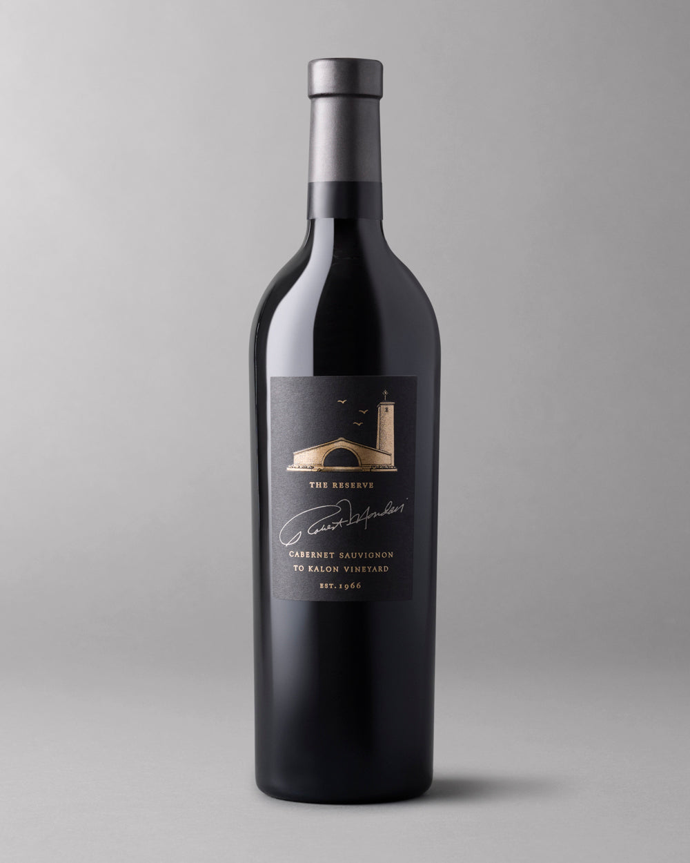 A bottle of 2018 To Kalon Reserve Cabernet Sauvignon on a grey background.