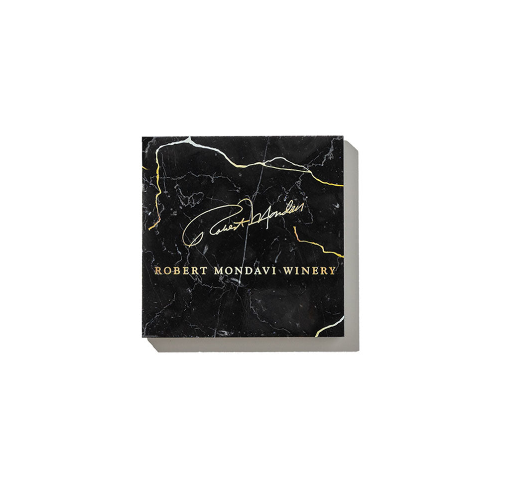 Handcrafted Black and Gold Marble Coasters with Robert Mondavi signature on it in gold