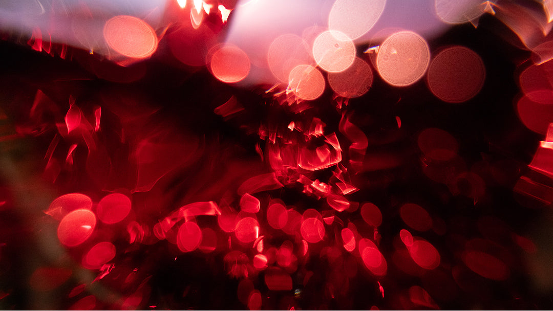 Red and pink blurred lights on a dark background