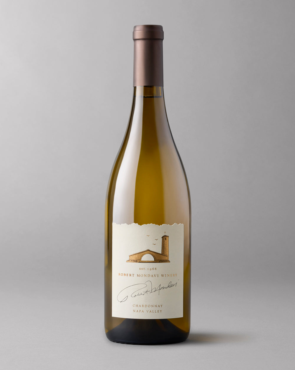 A bottle of 2024 Chardonnay Napa Valley on a grey background.