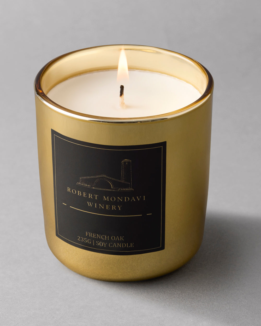 A hand poured soy candle in a Gold Vessel French Oak aroma