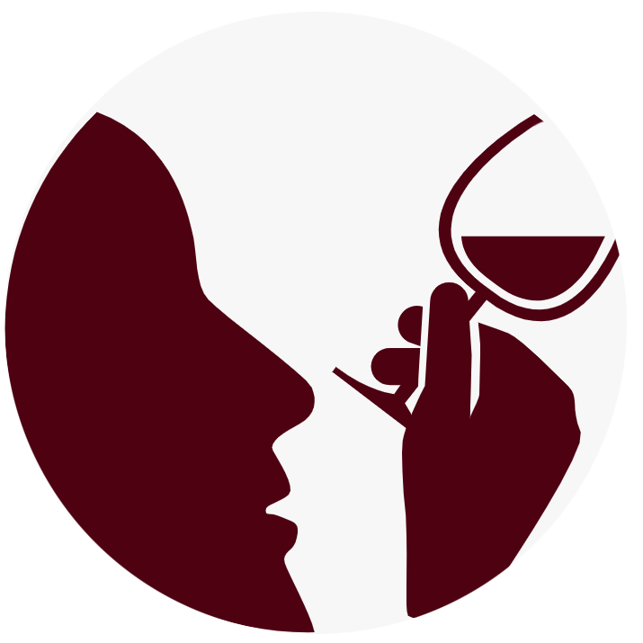 The silhouette of a person looking at a wine glass.