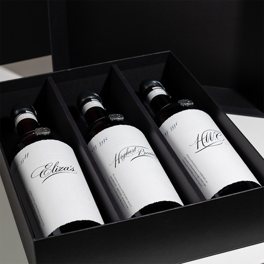 3 bottles of wine - Eliza's Red Wine, Highest Beauty Cabernet Sauvignon, and HWC Cabernet Sauvignon - in a black gift box 